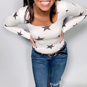 Star body suit. New with tags.